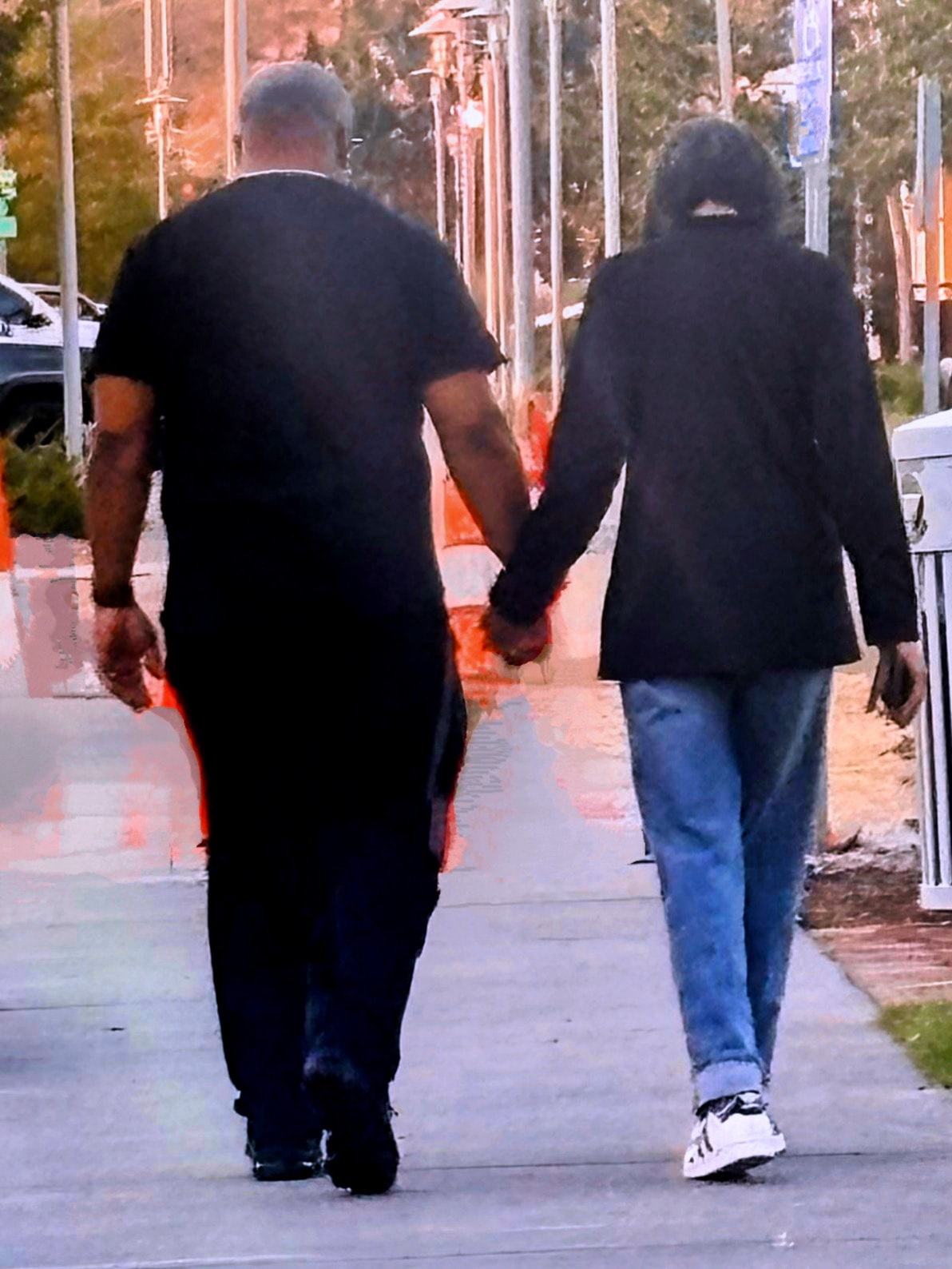 Tony and Veta Jeffery walking together hand in hand